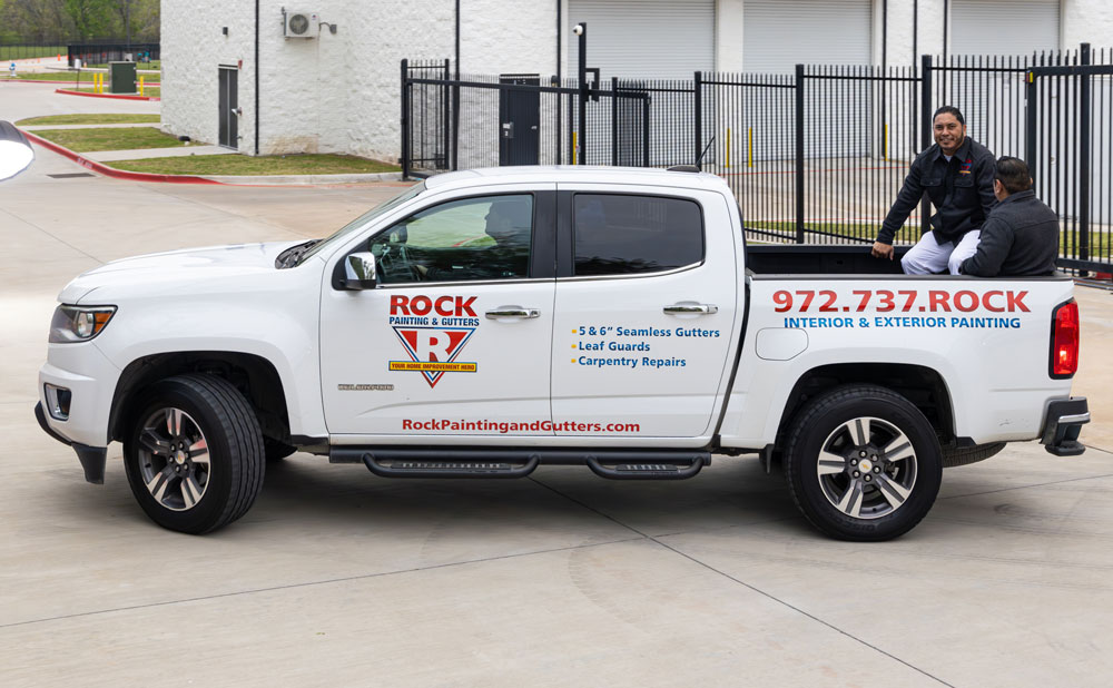 Photo of the crew in the Rock Painting and Gutters work truck